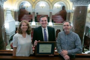 NYSHA's Diane Fingar and John Scheib presented award to Senator Gianaris.