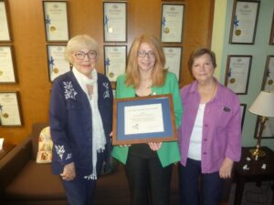 NYSHA's Pat Valusek and Sondra Woodvine presented award to Assembly Member Rosenthal.